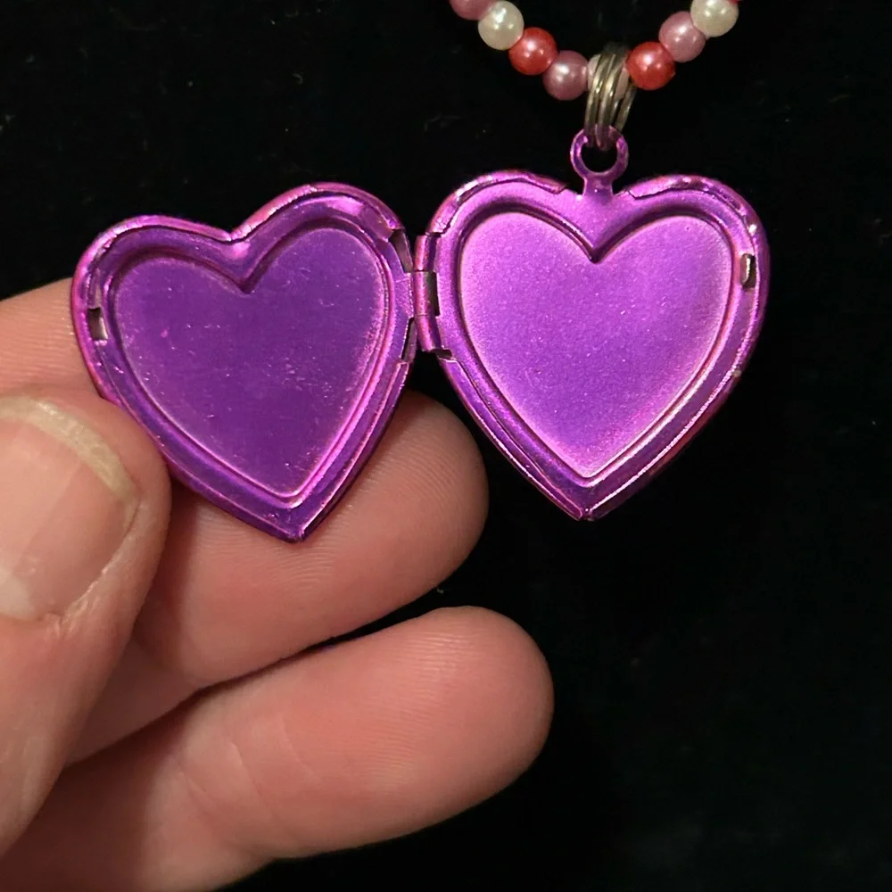 Pink and white beaded necklace with Dora the Explorer locket